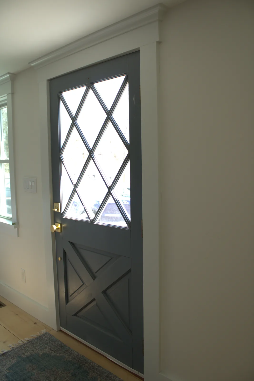 Interior door with diamond pattern glass and painted trim