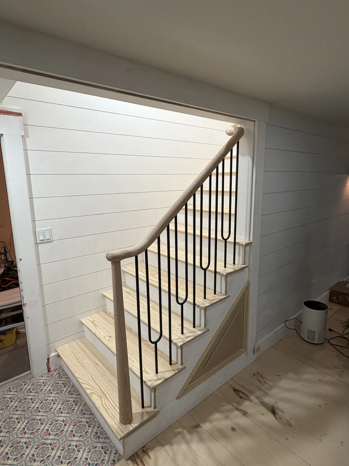 New stair with iron balusters and shiplap