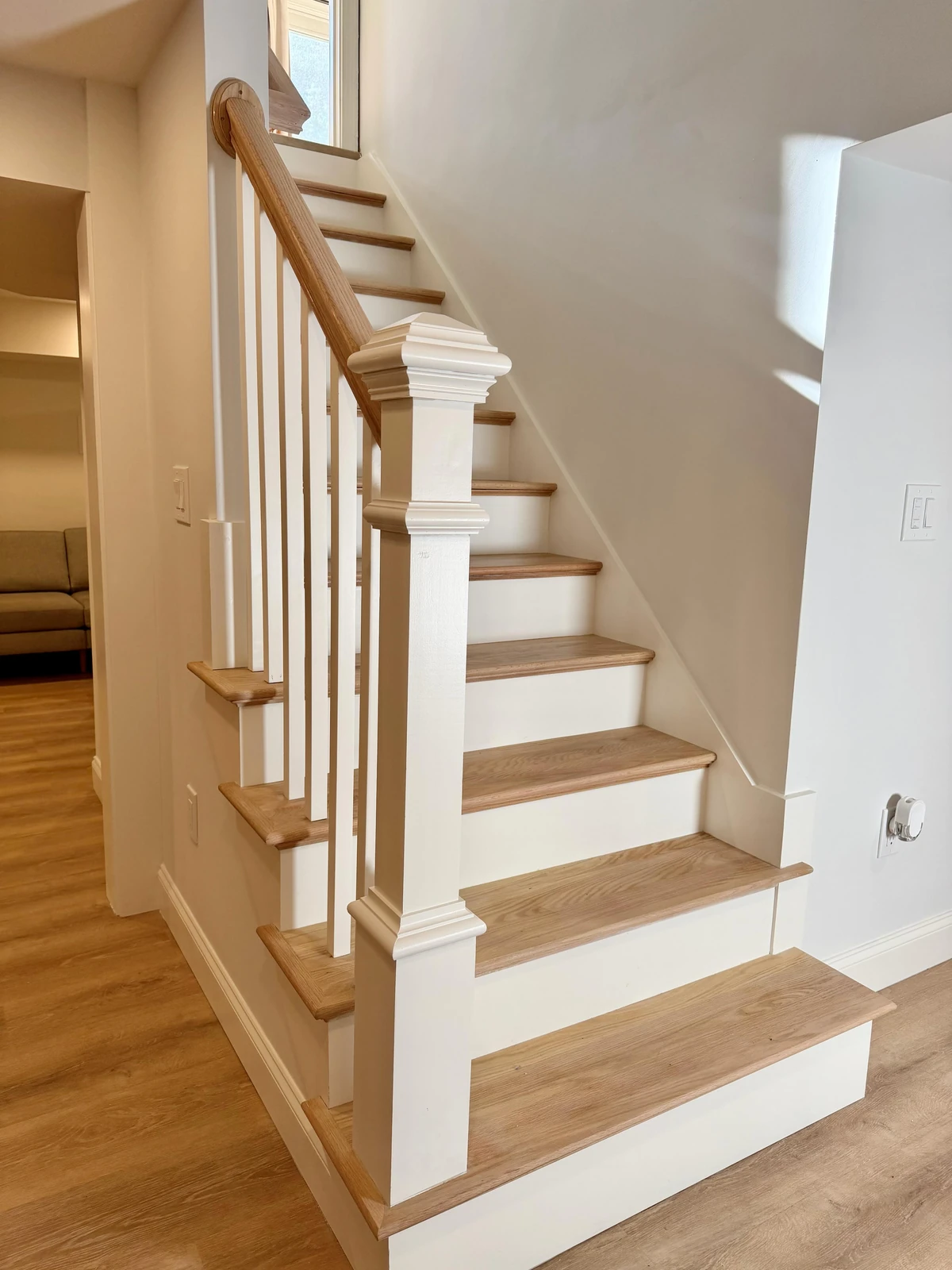 Painted stair with oak treads and a box newel