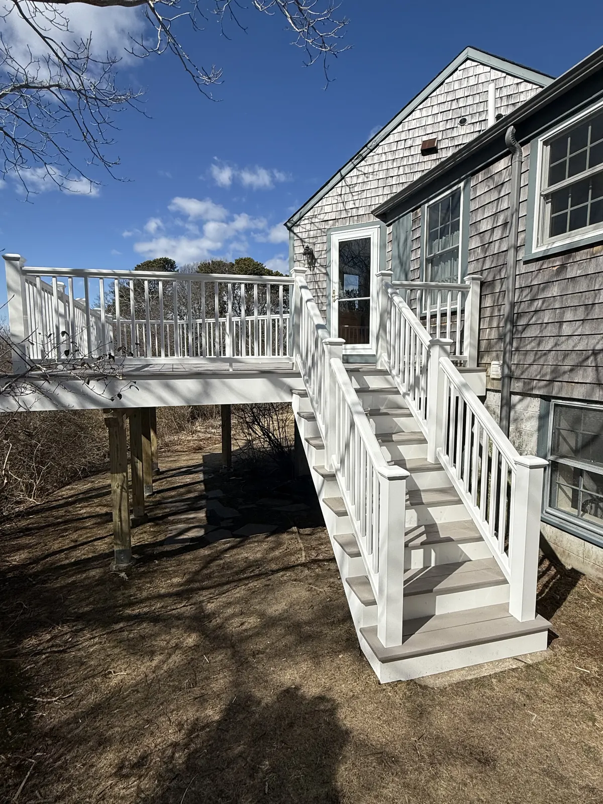 Raised deck with stairs and railing