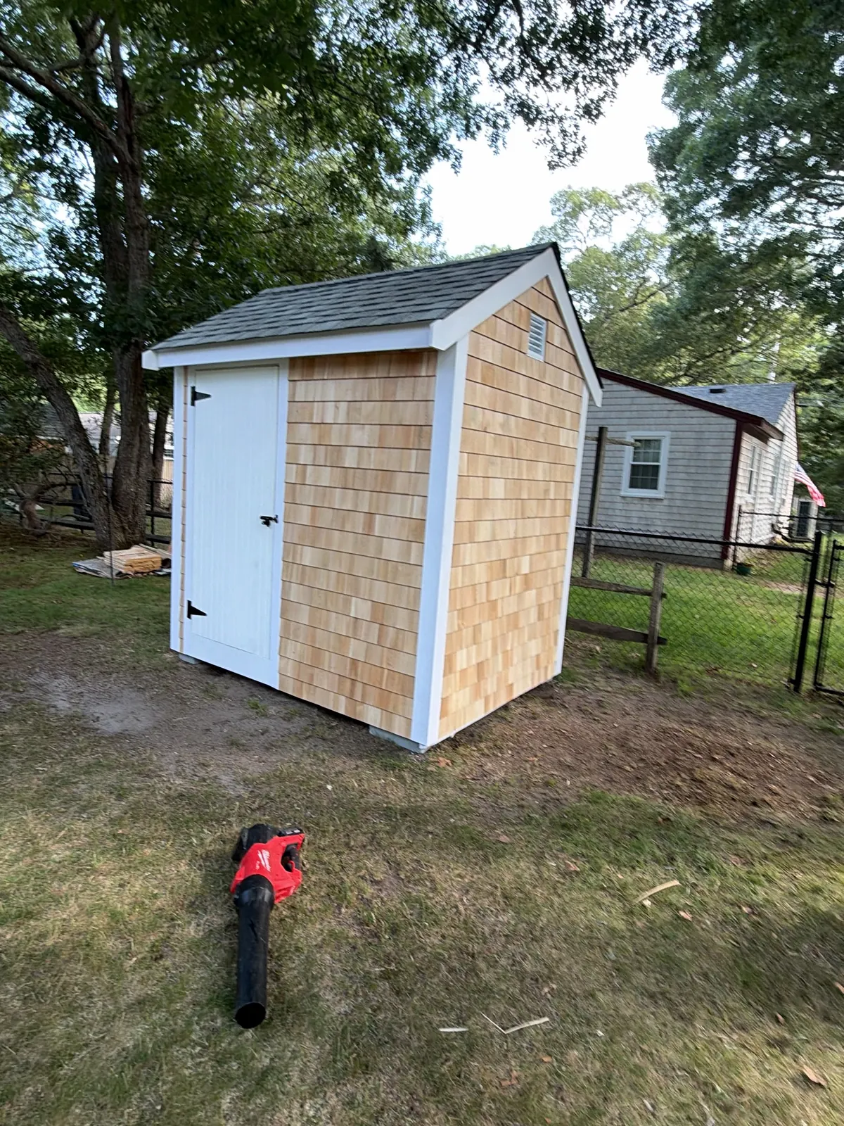 New cedar shingles on a backyard shed