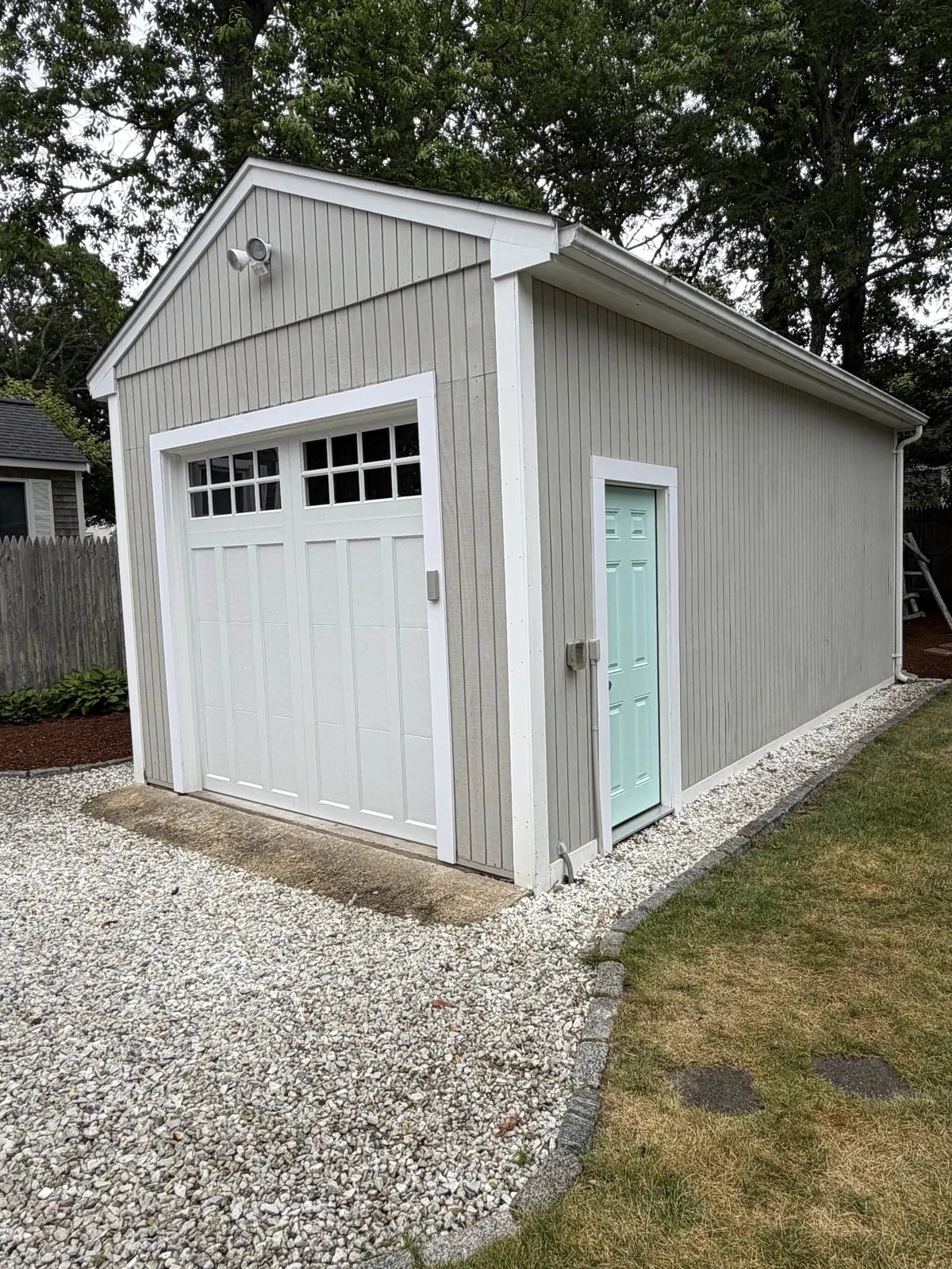 Detached garage with new siding and doors