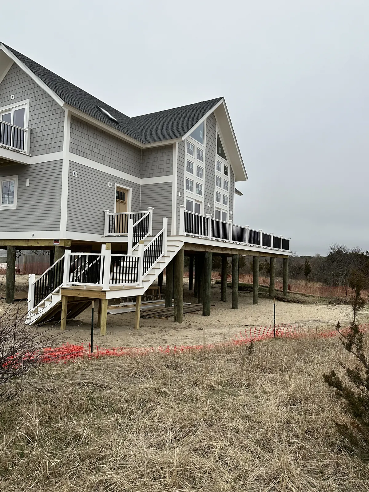 Elevated home with new siding and railings