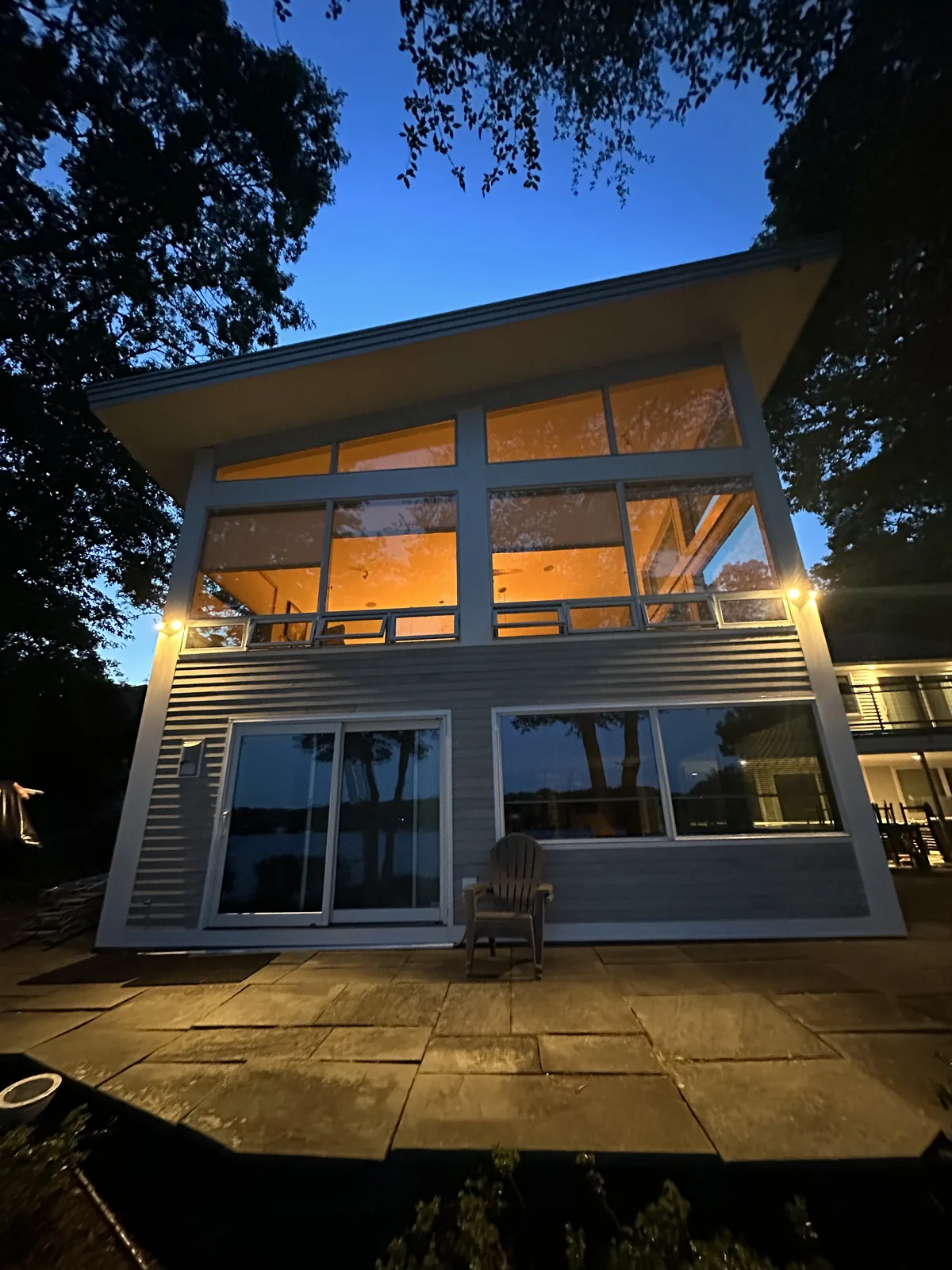 Waterfront home with a wall of windows