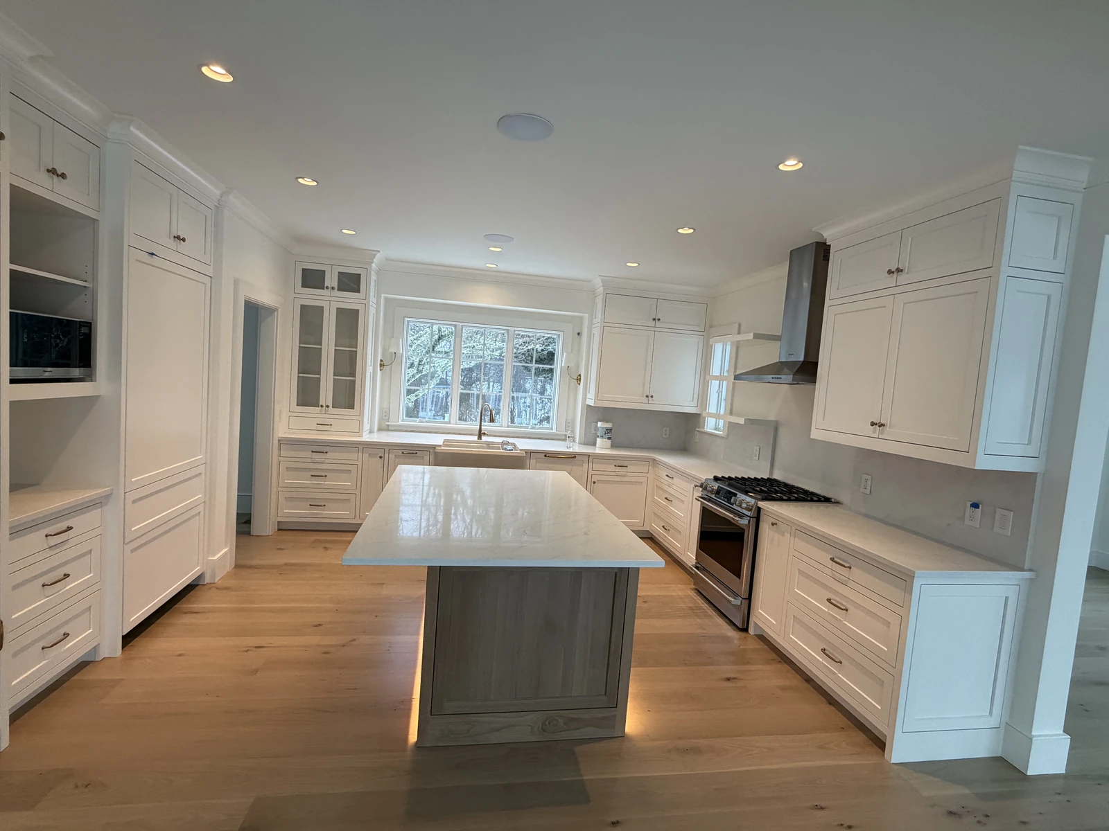 White shaker kitchen with a center island