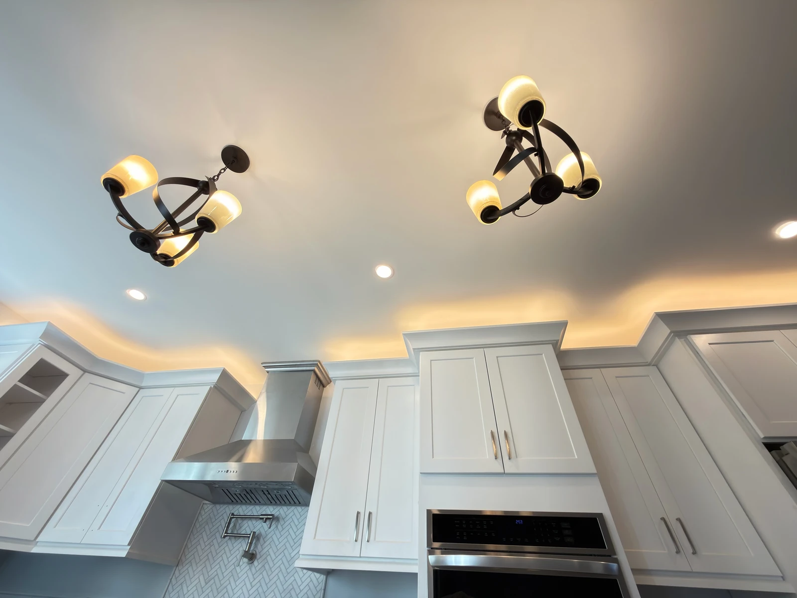 Custom cabinets and layered kitchen lighting