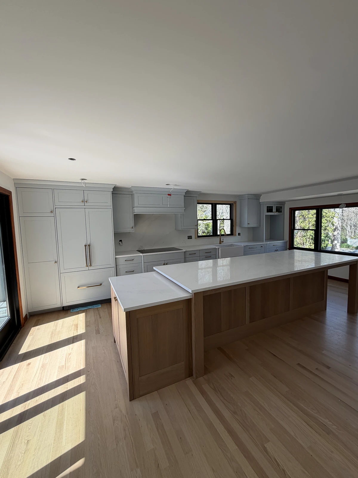 Open kitchen with a wood base island